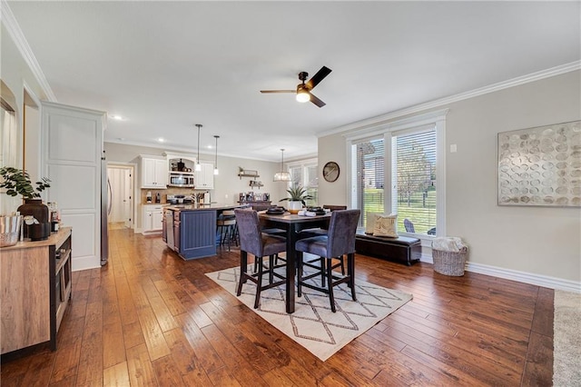 204 SW Ansel Adams Dr, Lees Summit, MO 64081 - dining space featuring ceiling fan, dark wood-style flooring, ornamental molding, and recessed lighting