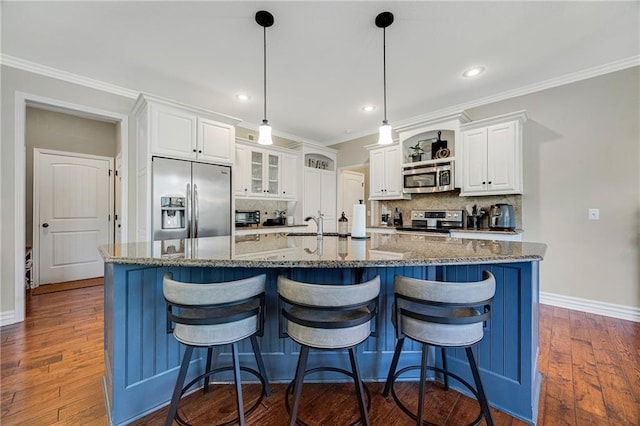 204 SW Ansel Adams Dr, Lees Summit, MO 64081 - kitchen featuring appliances with stainless steel finishes, decorative backsplash, white cabinets, dark wood-style floors, and crown molding