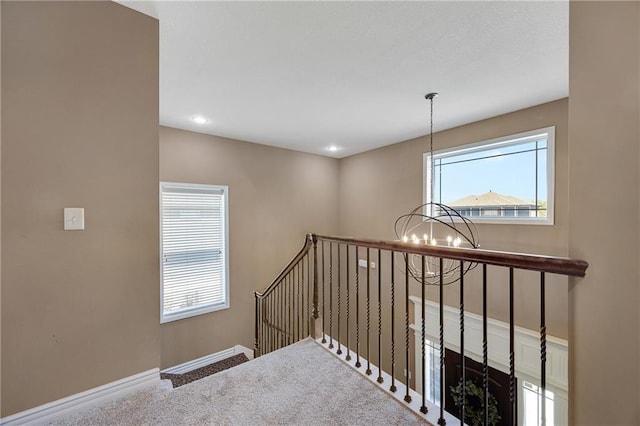 204 SW Ansel Adams Dr, Lees Summit, MO 64081 - stairs with a chandelier and carpet