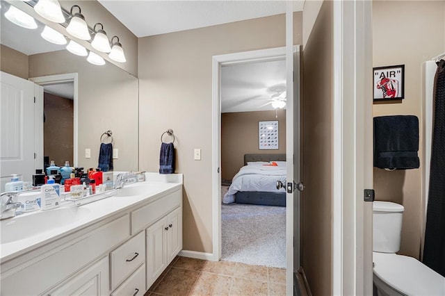 204 SW Ansel Adams Dr, Lees Summit, MO 64081 - ensuite bathroom featuring double vanity, tile patterned flooring, and a ceiling fan