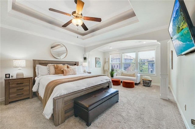 204 SW Ansel Adams Dr, Lees Summit, MO 64081 - bedroom featuring a raised ceiling, light carpet, arched walkways, ornamental molding, and ceiling fan
