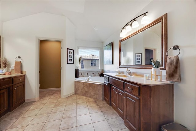 204 SW Ansel Adams Dr, Lees Summit, MO 64081 - bathroom with vaulted ceiling, vanity, a bath, and tile patterned floors