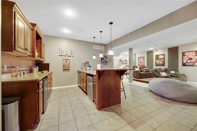 204 SW Ansel Adams Dr, Lees Summit, MO 64081 - kitchen featuring beverage cooler, a kitchen bar, backsplash, open floor plan, and light tile patterned floors