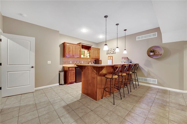 204 SW Ansel Adams Dr, Lees Summit, MO 64081 - kitchen with a breakfast bar, light tile patterned floors, a peninsula, open shelves, and decorative backsplash