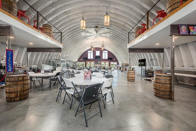 24305 Loring Rd, Lawrence, KS 66044 - dining space with concrete flooring and vaulted ceiling