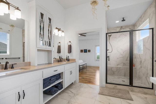 8319 Pickering St, Lenexa, KS 66227 - bathroom featuring marble look tiles, healthy amount of natural light, and a marble finish shower