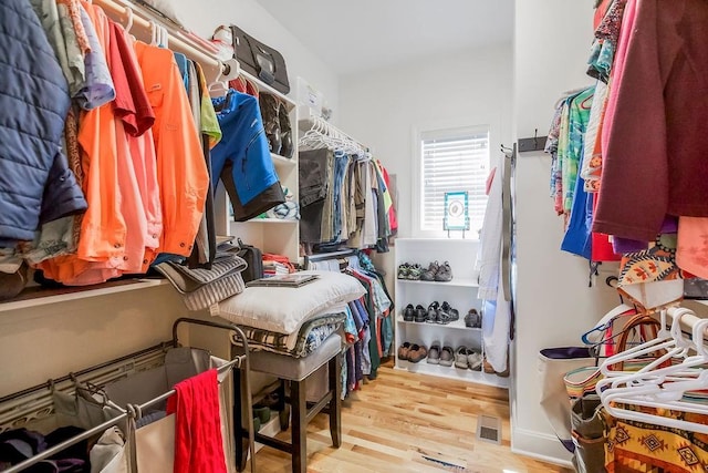 8319 Pickering St, Lenexa, KS 66227 - walk in closet featuring wood finished floors