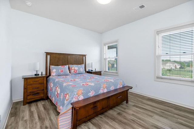 8319 Pickering St, Lenexa, KS 66227 - bedroom with light wood-type flooring and baseboards