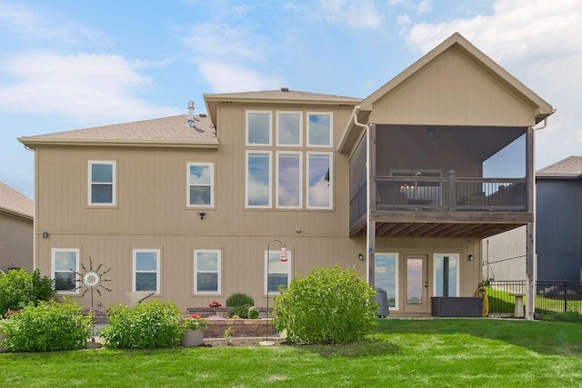 8319 Pickering St, Lenexa, KS 66227 - back of house featuring a sunroom and a shingled roof