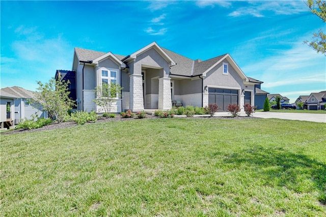11126 W 172nd Ter, Overland Park, KS 66221 - view of front of house featuring stucco siding, concrete driveway, an attached garage, and a front lawn