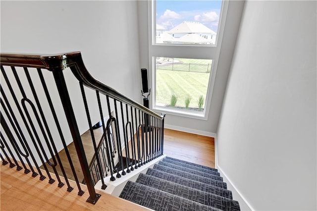 11126 W 172nd Ter, Overland Park, KS 66221 - staircase featuring wood finished floors and a high ceiling