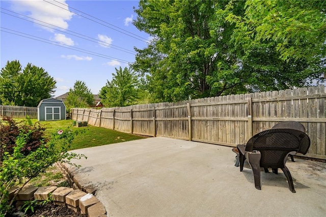 1210 NW Persimmon Dr, Grain Valley, MO 64029 - fenced backyard with a patio area and a storage shed