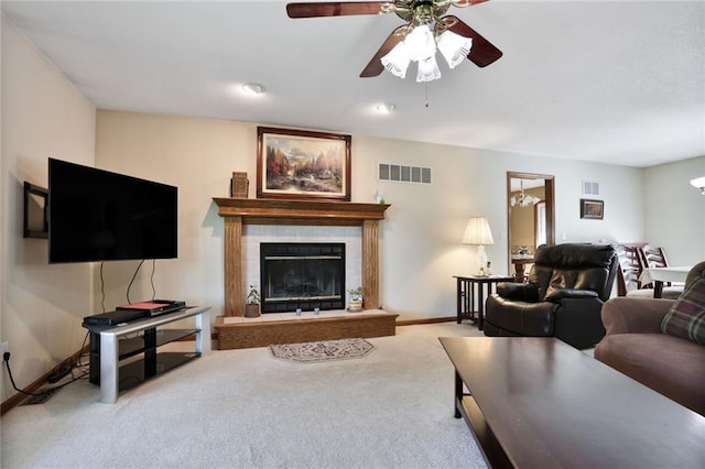 3038 Weaver School Rd, Odessa, MO 64076 - carpeted living area featuring ceiling fan and a tiled fireplace