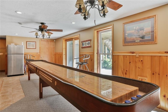 3038 Weaver School Rd, Odessa, MO 64076 - rec room with ceiling fan, wainscoting, light tile patterned floors, recessed lighting, and wood walls