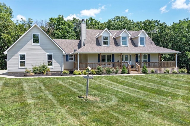 3038 Weaver School Rd, Odessa, MO 64076 - view of front of house featuring a chimney, a front yard, a porch, and view of wooded area