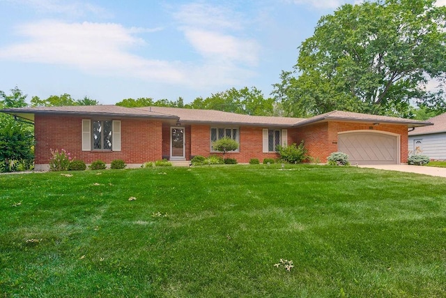 7718 W 100th St, Overland Park, KS 66212 - ranch-style home with an attached garage, brick siding, a front yard, and driveway