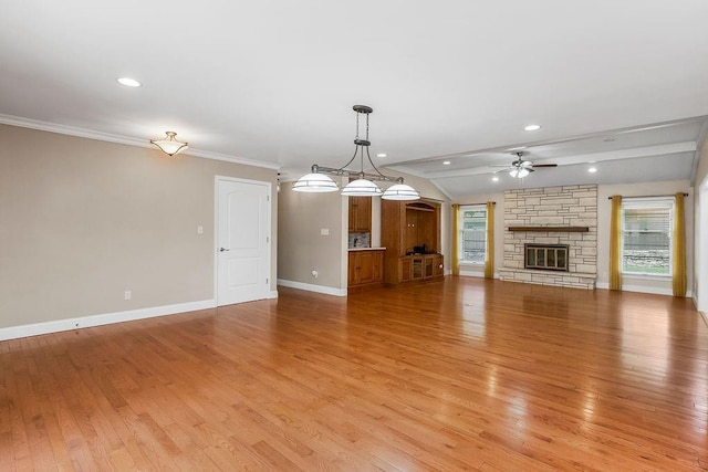 7718 W 100th St, Overland Park, KS 66212 - unfurnished living room with ceiling fan, a fireplace, light wood-type flooring, vaulted ceiling, and recessed lighting