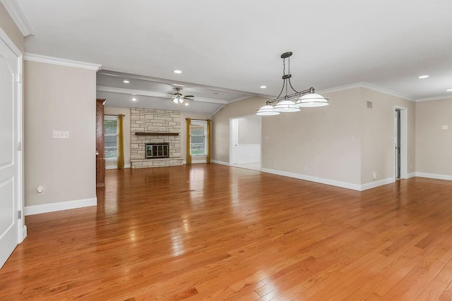 7718 W 100th St, Overland Park, KS 66212 - unfurnished living room with a ceiling fan, light wood-type flooring, a stone fireplace, recessed lighting, and vaulted ceiling