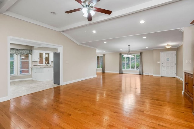 7718 W 100th St, Overland Park, KS 66212 - unfurnished living room featuring light wood-style flooring, recessed lighting, ceiling fan, and crown molding