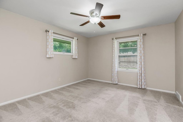 7718 W 100th St, Overland Park, KS 66212 - carpeted spare room with healthy amount of natural light and ceiling fan