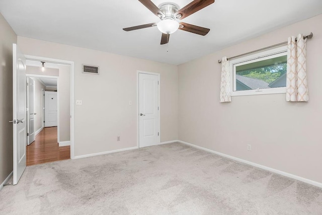 7718 W 100th St, Overland Park, KS 66212 - unfurnished bedroom featuring light colored carpet and ceiling fan
