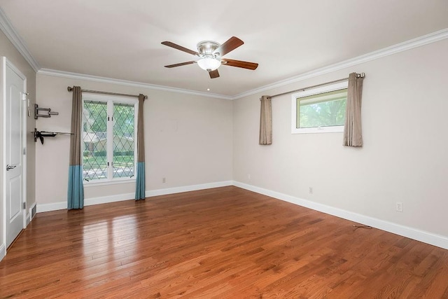 7718 W 100th St, Overland Park, KS 66212 - spare room with healthy amount of natural light, ceiling fan, wood finished floors, and crown molding