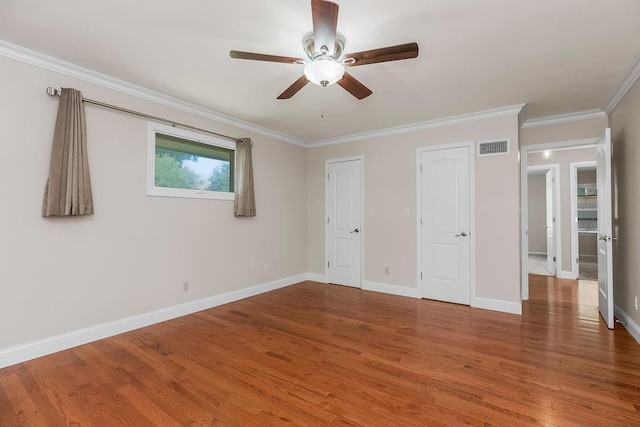 7718 W 100th St, Overland Park, KS 66212 - unfurnished bedroom featuring wood finished floors, crown molding, and ceiling fan