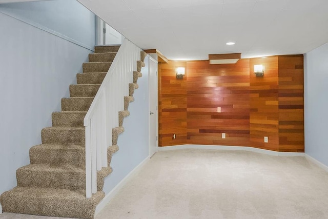 7718 W 100th St, Overland Park, KS 66212 - stairway with wooden walls, recessed lighting, and carpet floors