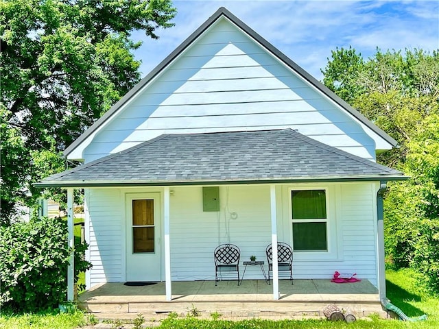 14364 N Bay St, Mercer, MO 64661 - back of house featuring a shingled roof and a porch