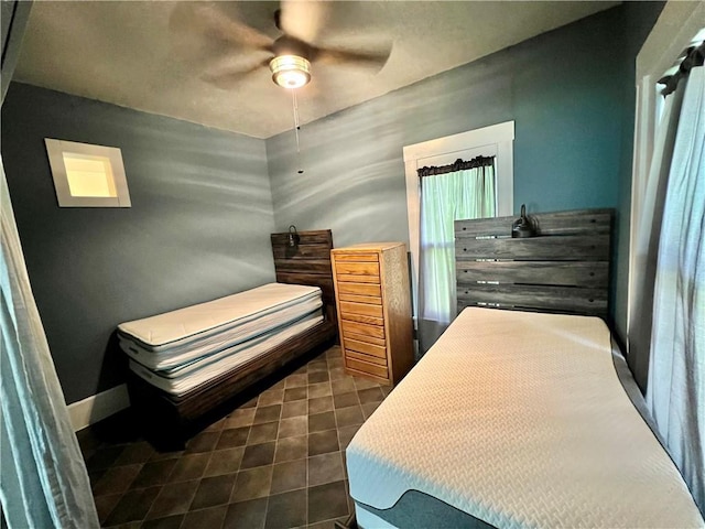 14364 N Bay St, Mercer, MO 64661 - bedroom featuring ceiling fan and dark tile patterned flooring