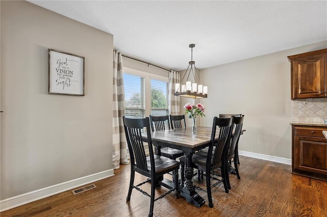 18501 S Butternut St W, Gardner, KS 66030 - dining area featuring dark wood-style flooring and a chandelier