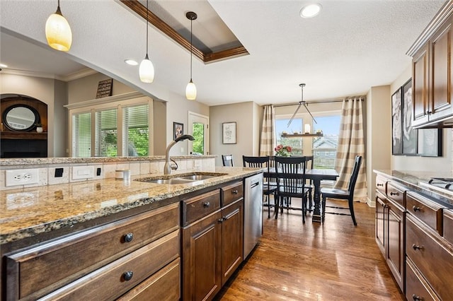 18501 S Butternut St W, Gardner, KS 66030 - kitchen featuring dishwasher, light stone countertops, wood finished floors, pendant lighting, and crown molding
