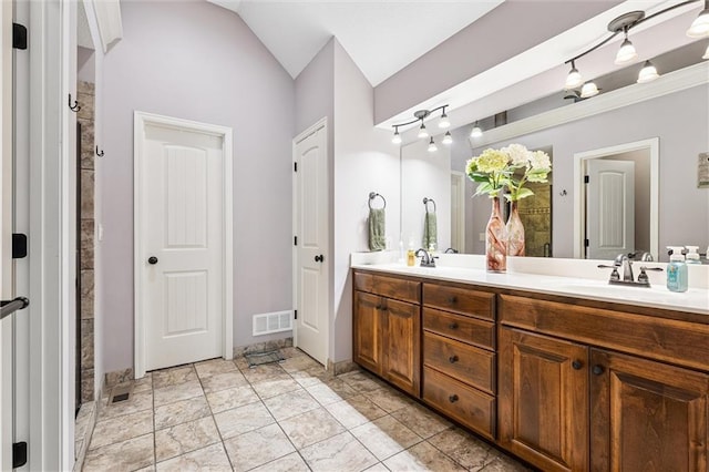 18501 S Butternut St W, Gardner, KS 66030 - bathroom featuring double vanity and vaulted ceiling