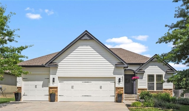 18501 S Butternut St W, Gardner, KS 66030 - view of front of house featuring an attached garage, concrete driveway, roof with shingles, and brick siding