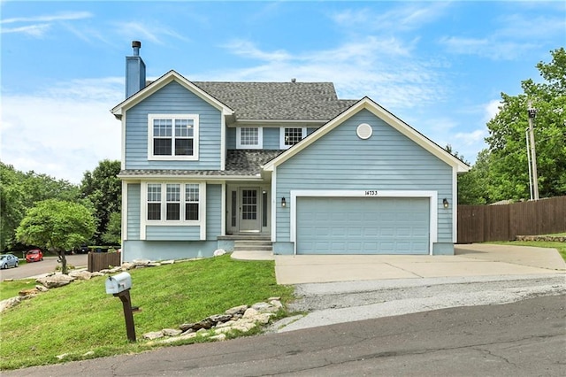 14733 Hickory Dr, Bonner Springs, KS 66012 - view of front of property featuring driveway, a chimney, an attached garage, and a shingled roof
