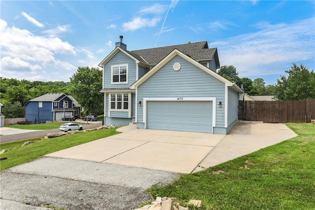14733 Hickory Dr, Bonner Springs, KS 66012 - traditional-style home featuring a chimney, driveway, and a garage