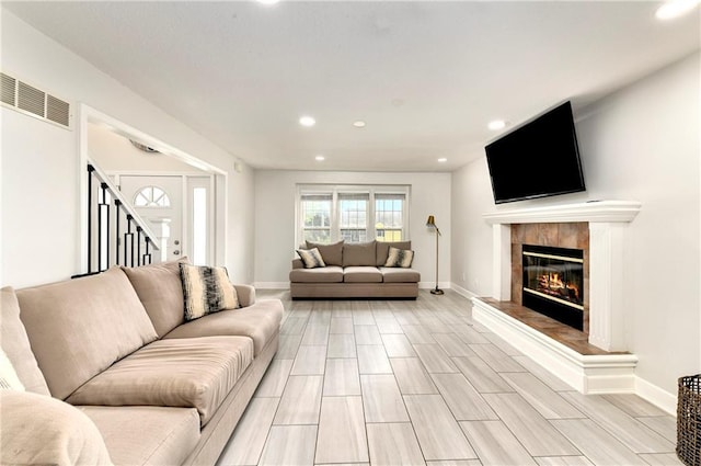 14733 Hickory Dr, Bonner Springs, KS 66012 - living room featuring recessed lighting and a tiled fireplace