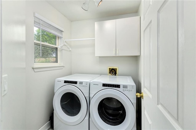 14733 Hickory Dr, Bonner Springs, KS 66012 - washroom featuring washing machine and dryer and cabinet space