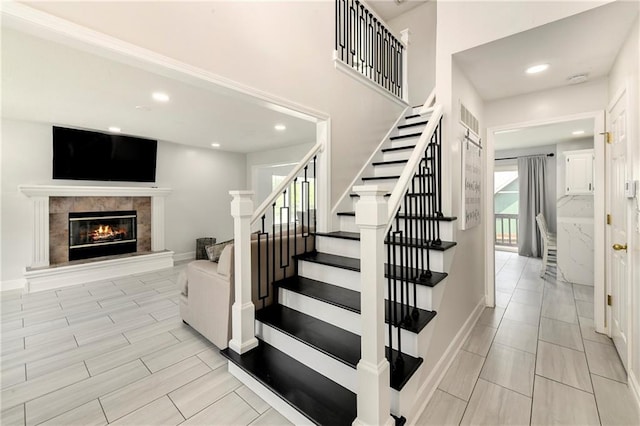 14733 Hickory Dr, Bonner Springs, KS 66012 - stairway featuring a high end fireplace and recessed lighting