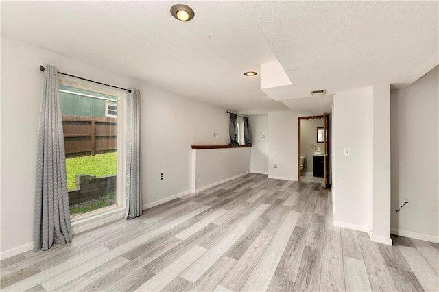 14733 Hickory Dr, Bonner Springs, KS 66012 - empty room with light wood-type flooring and recessed lighting