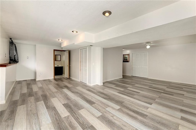 14733 Hickory Dr, Bonner Springs, KS 66012 - unfurnished living room featuring light wood finished floors and a ceiling fan
