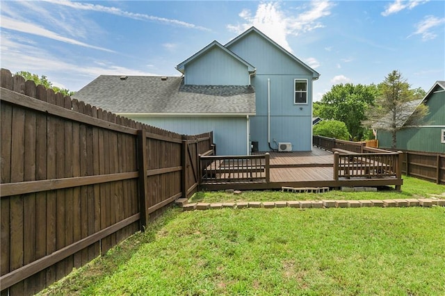 14733 Hickory Dr, Bonner Springs, KS 66012 - rear view of property with roof with shingles, a deck, and a fenced backyard
