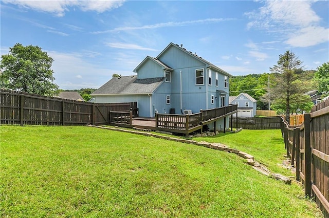 14733 Hickory Dr, Bonner Springs, KS 66012 - back of property with a deck and a fenced backyard