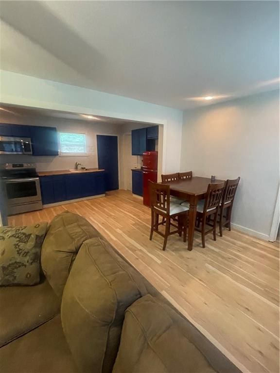 1807 Dodds Camp Rd, Climax Springs, MO 65324 - dining area with light wood-type flooring and baseboards