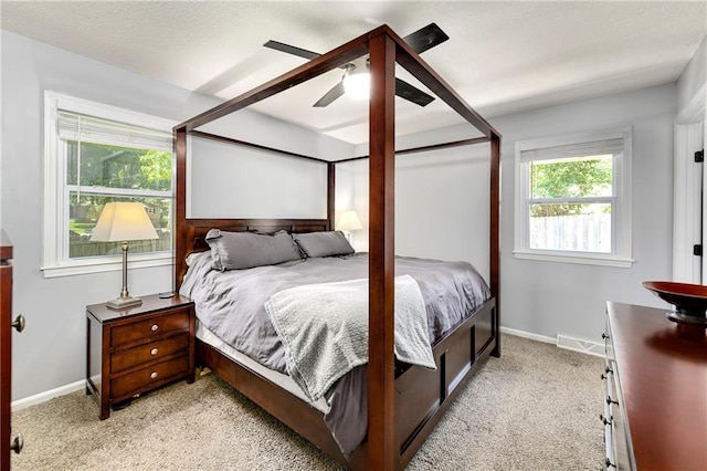1410 Vilas St, Leavenworth, KS 66048 - bedroom with light colored carpet and a ceiling fan
