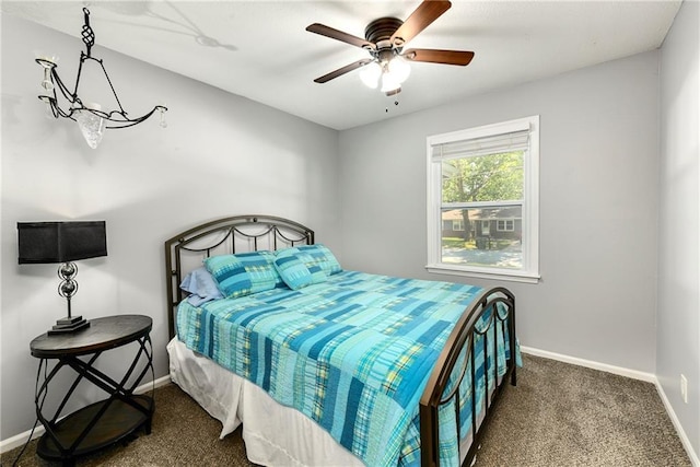 1410 Vilas St, Leavenworth, KS 66048 - carpeted bedroom with baseboards and a ceiling fan