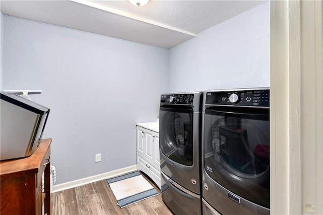 1410 Vilas St, Leavenworth, KS 66048 - laundry area with separate washer and dryer and wood finished floors
