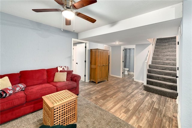 1410 Vilas St, Leavenworth, KS 66048 - living room with wood finished floors, stairway, and ceiling fan