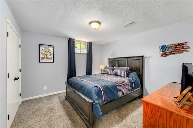 1410 Vilas St, Leavenworth, KS 66048 - carpeted bedroom featuring a textured ceiling