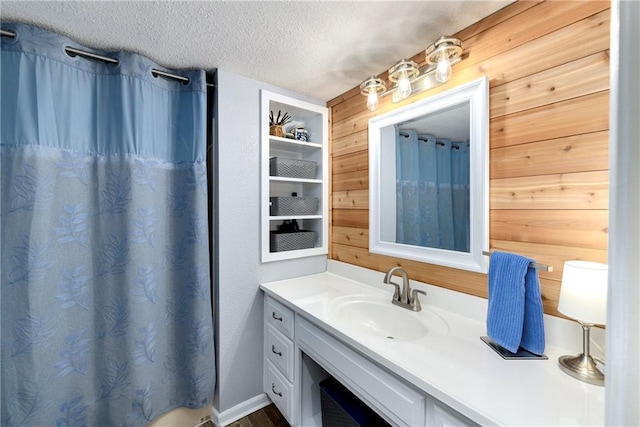 1410 Vilas St, Leavenworth, KS 66048 - full bathroom featuring vanity, a textured ceiling, wood walls, and curtained shower